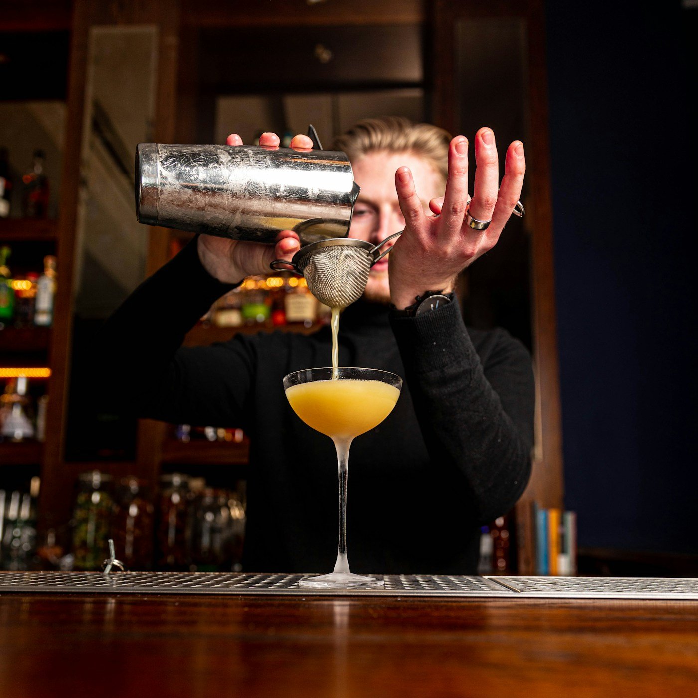 Cocktail preparation photographed at a bar